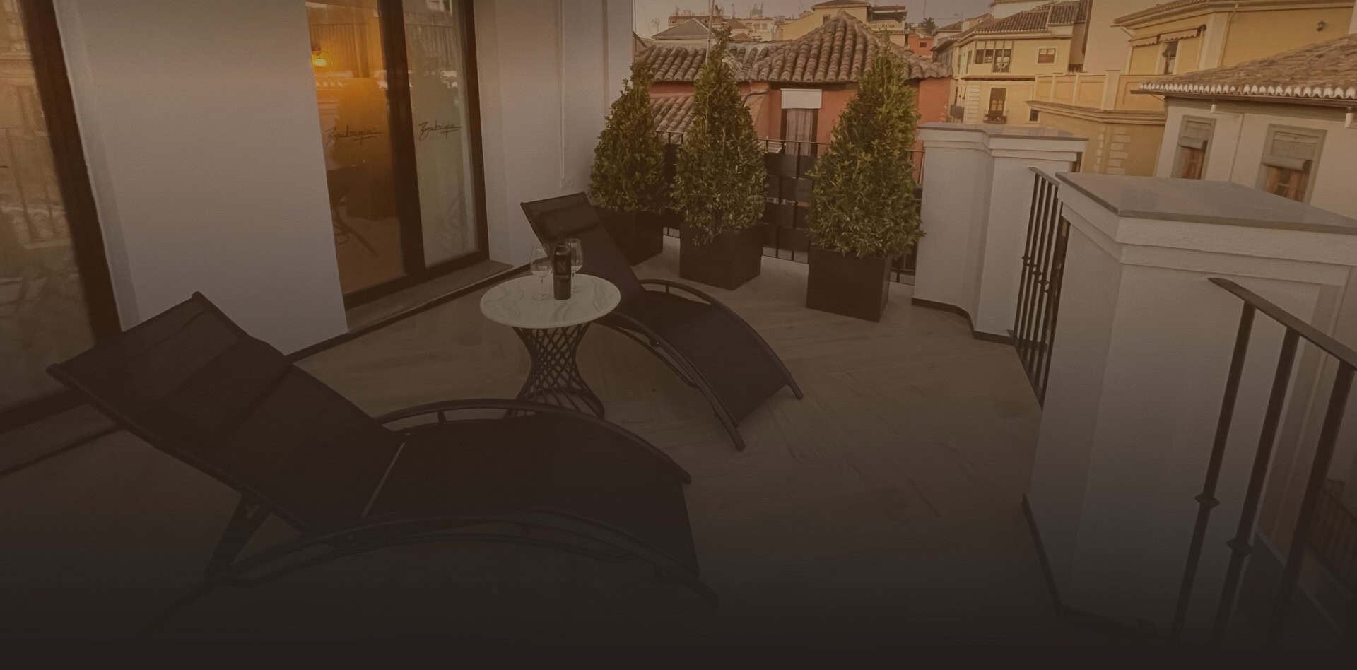 Bubaqia House terrace at dusk over the rooftops of Granada